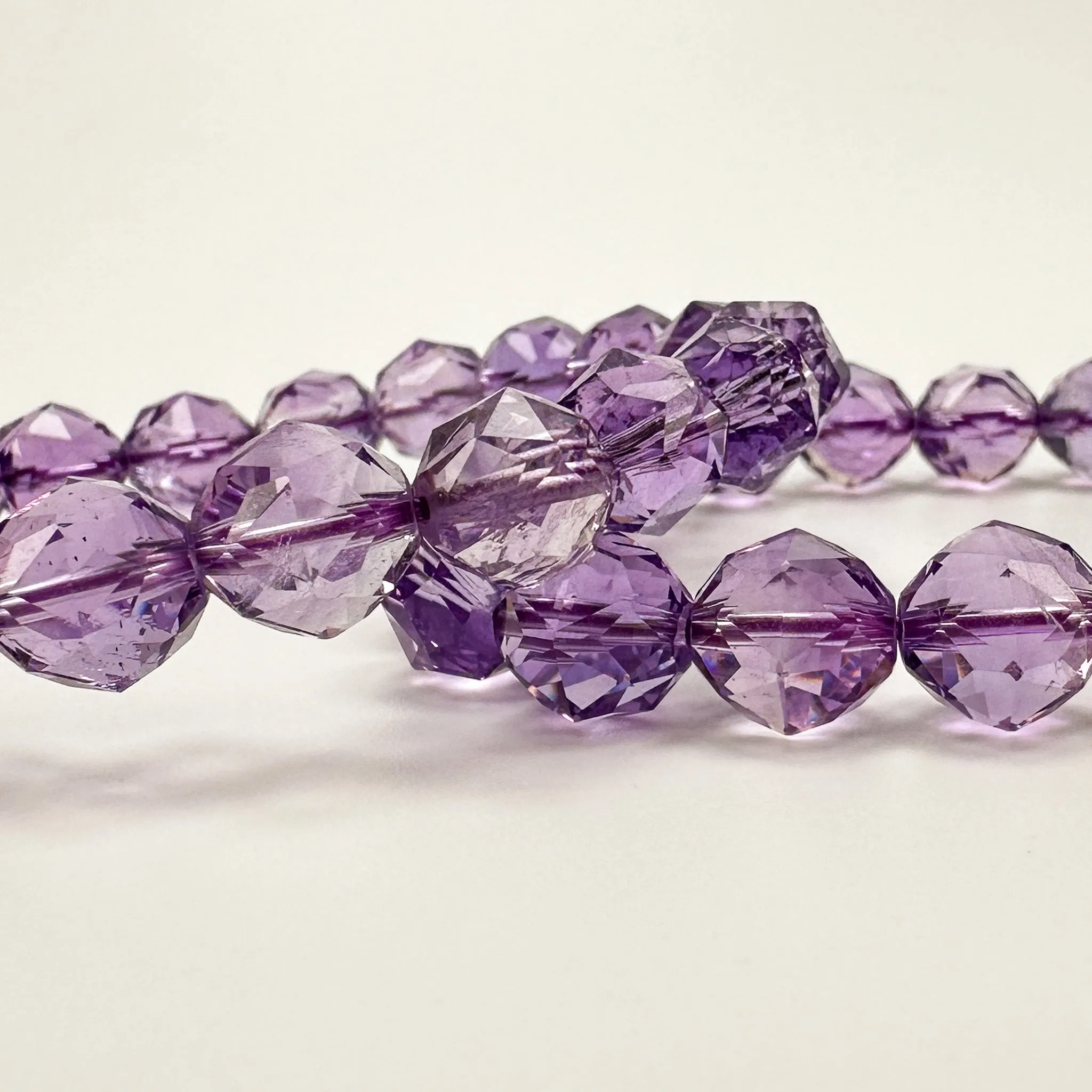 Amethyst 10mm Faceted Star Cut Stretchy Cord Bracelet (J292)